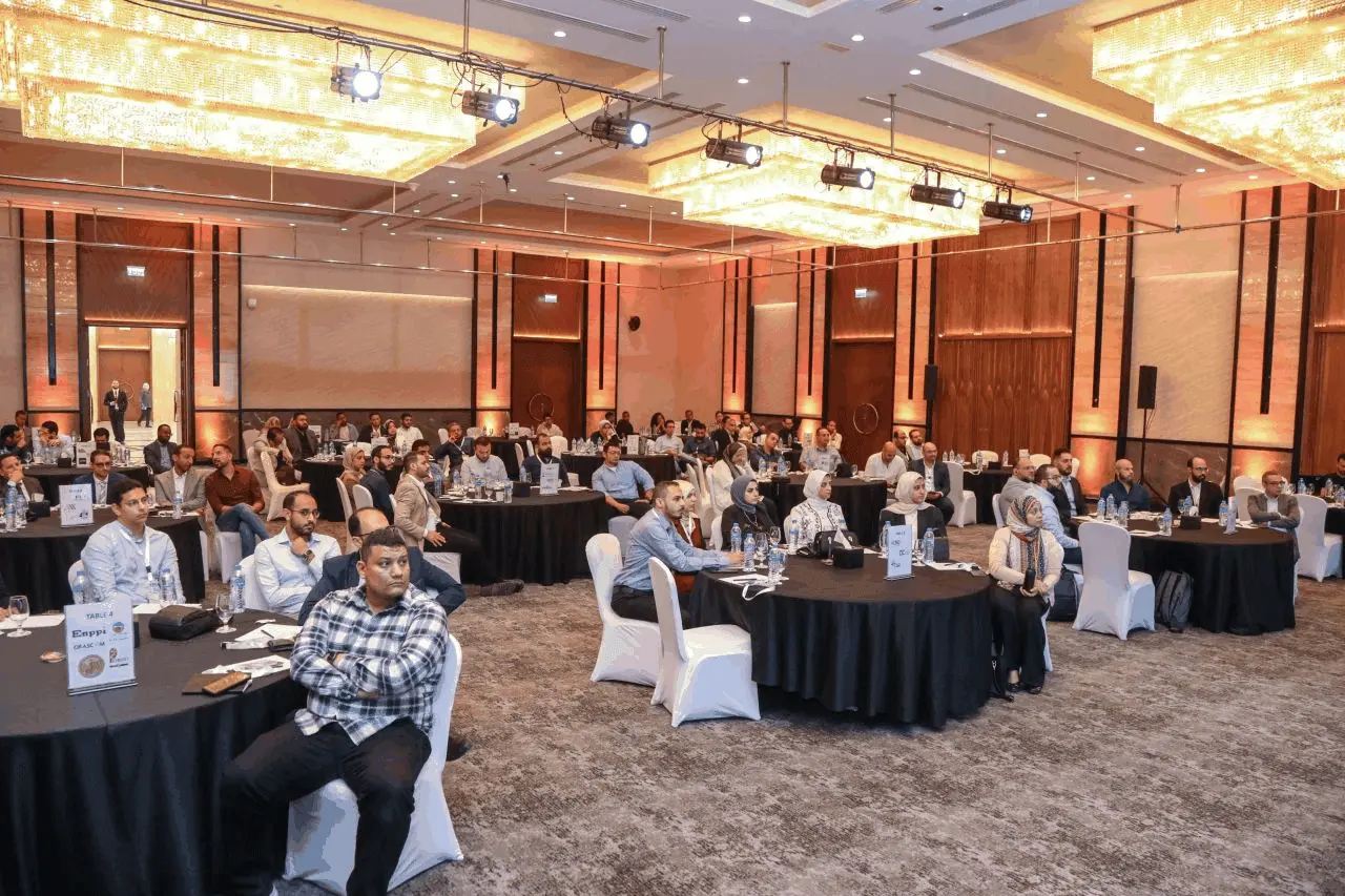 Attendees seated in the ballroom