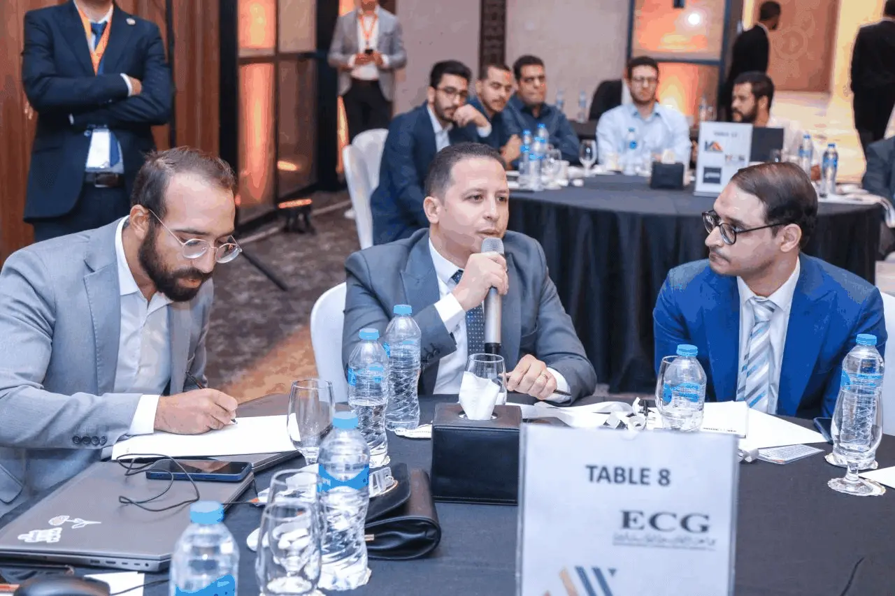 Attendee asking a question at the ECG table