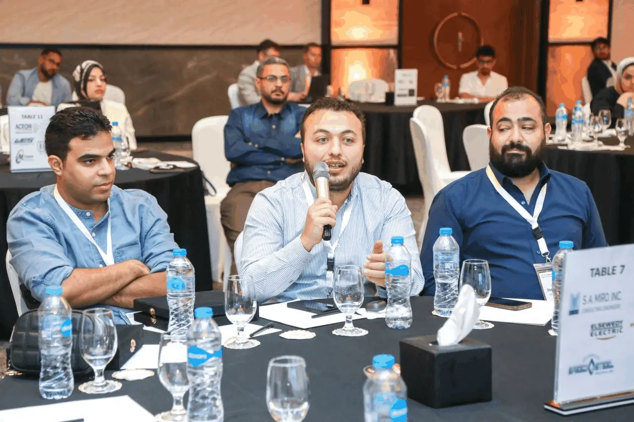 Attendee speaking at table 7
