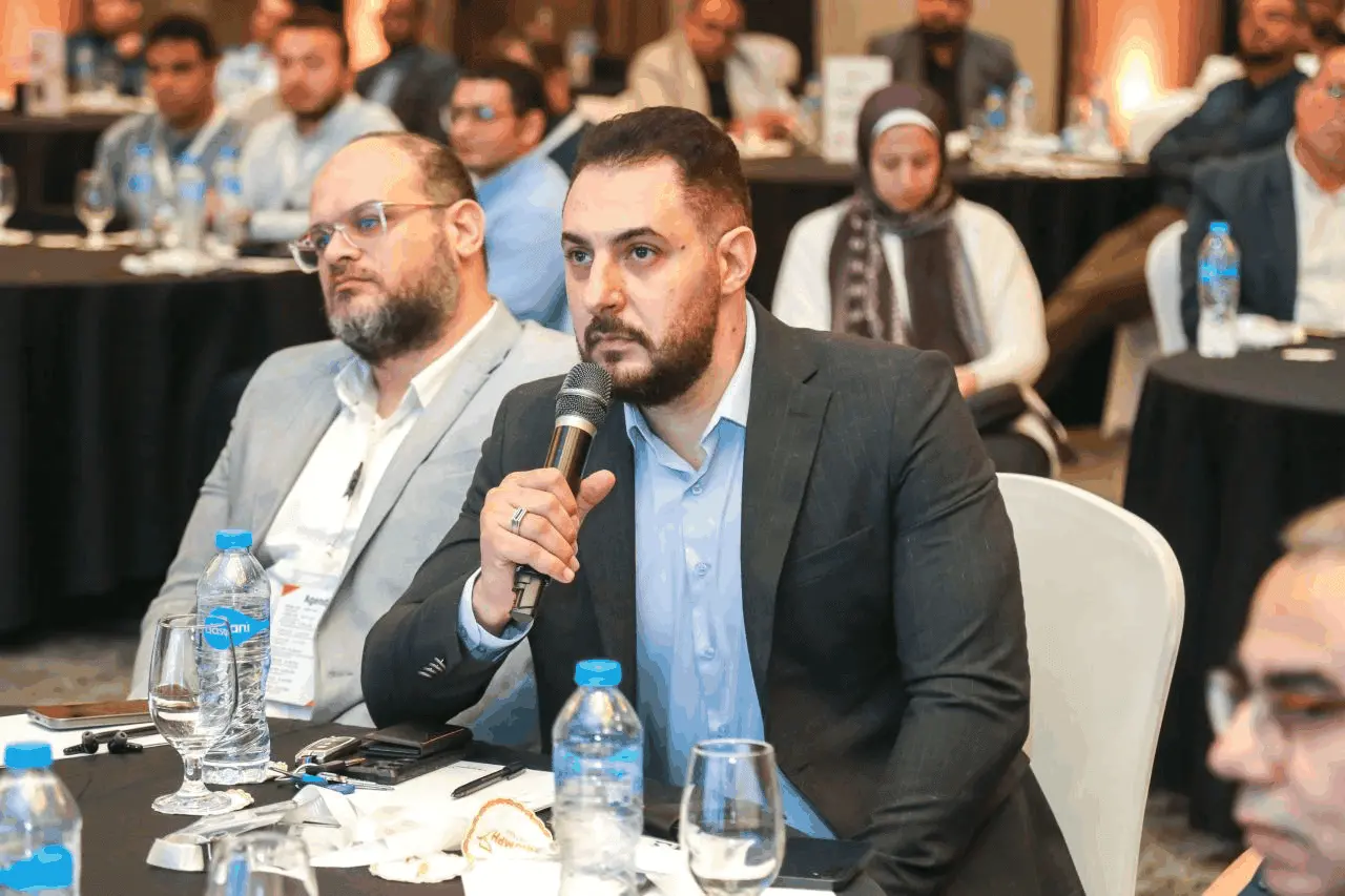Attendee asking a question during the session